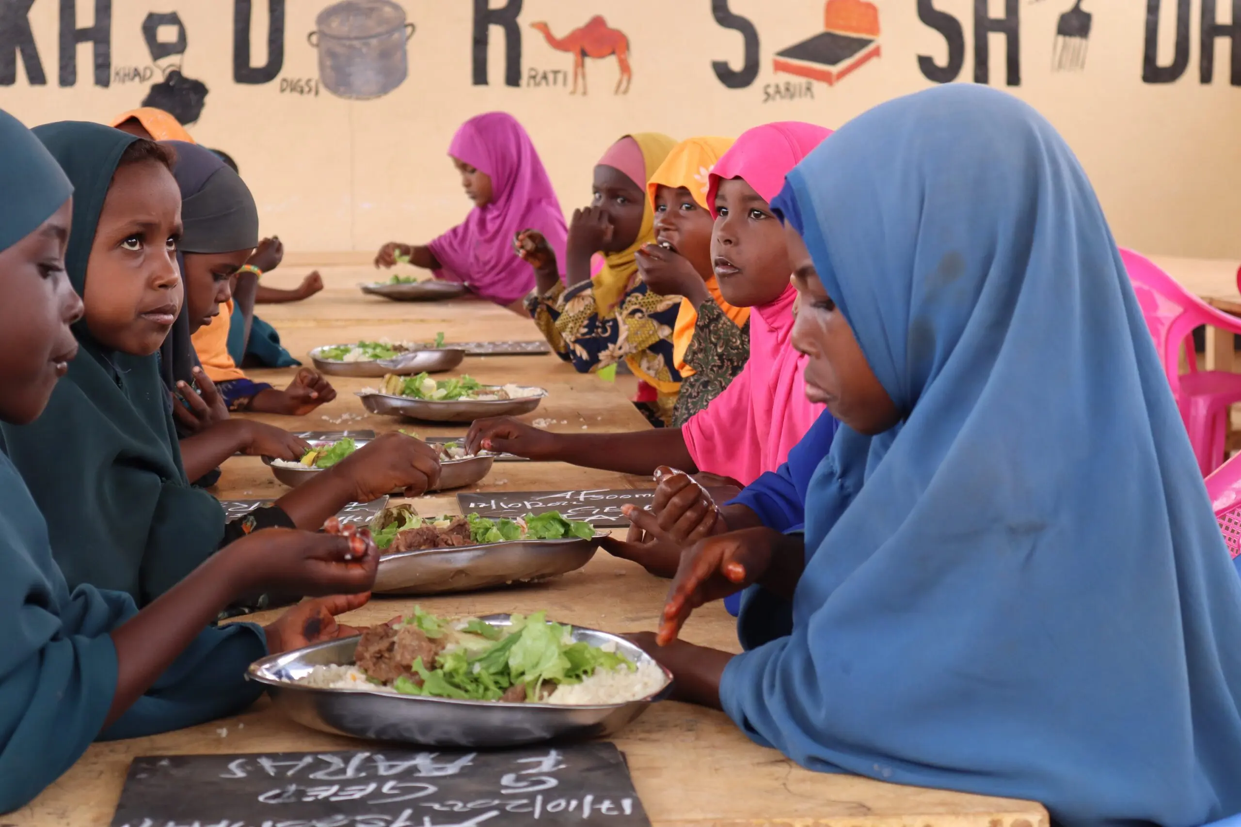 Children eating the school feeding meals at Kabasa Primary School in Dollow, Somalia.
