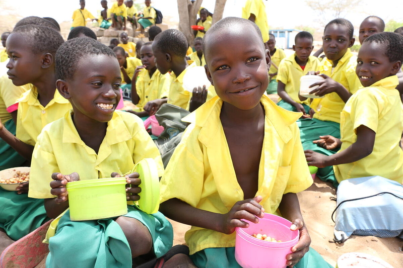 schoolchildren in yellow and green uniforms