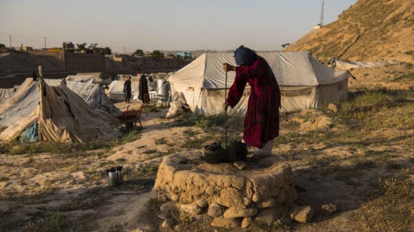 woman cooking at camp