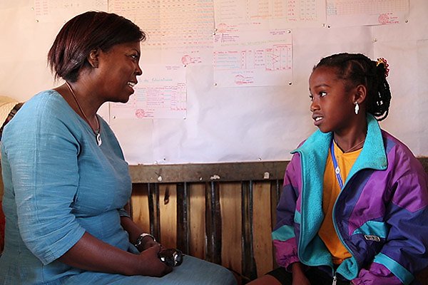 WFP's Executive Director Ertharin Cousin talks to Nicole, a 12-year-old school girl in Madagascar. 