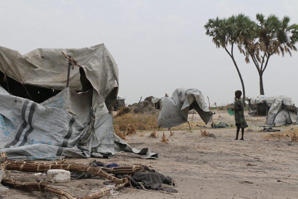 Children play around the makeshift tents they use as shelters for sleeping in Loth Village, South Sudan.