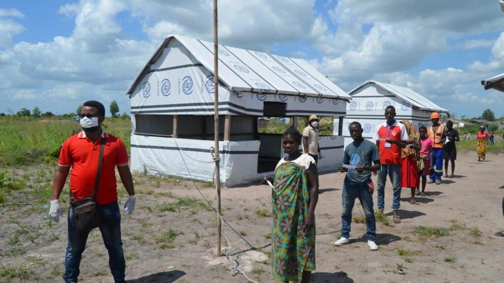 People wait for food in Mozambique
