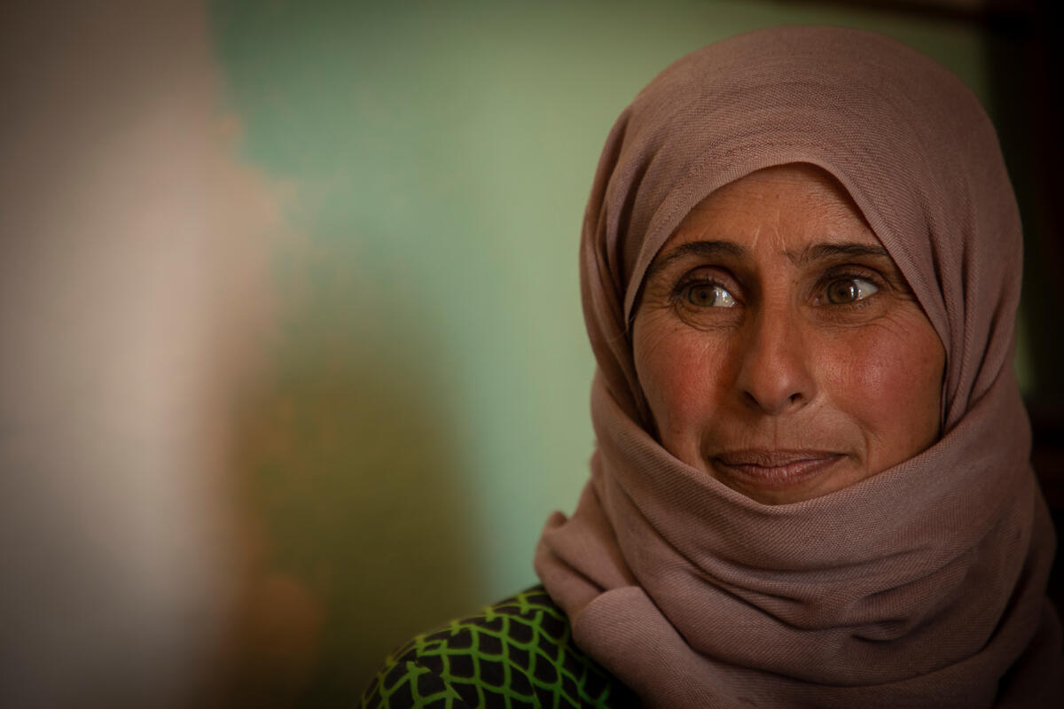 woman in purple headscarf