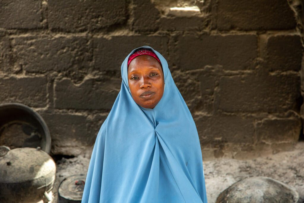 woman in blue headscarf