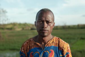man in orange and red shirt