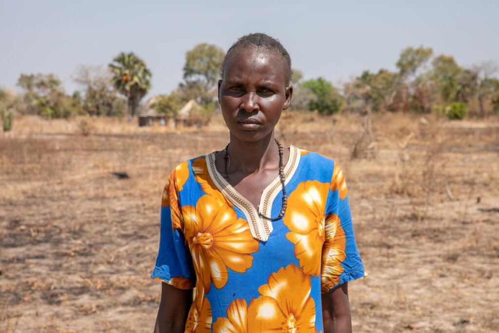 Woman in barren field in South Sudan