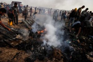 Gazans inspecting an IDP site after an airstrike