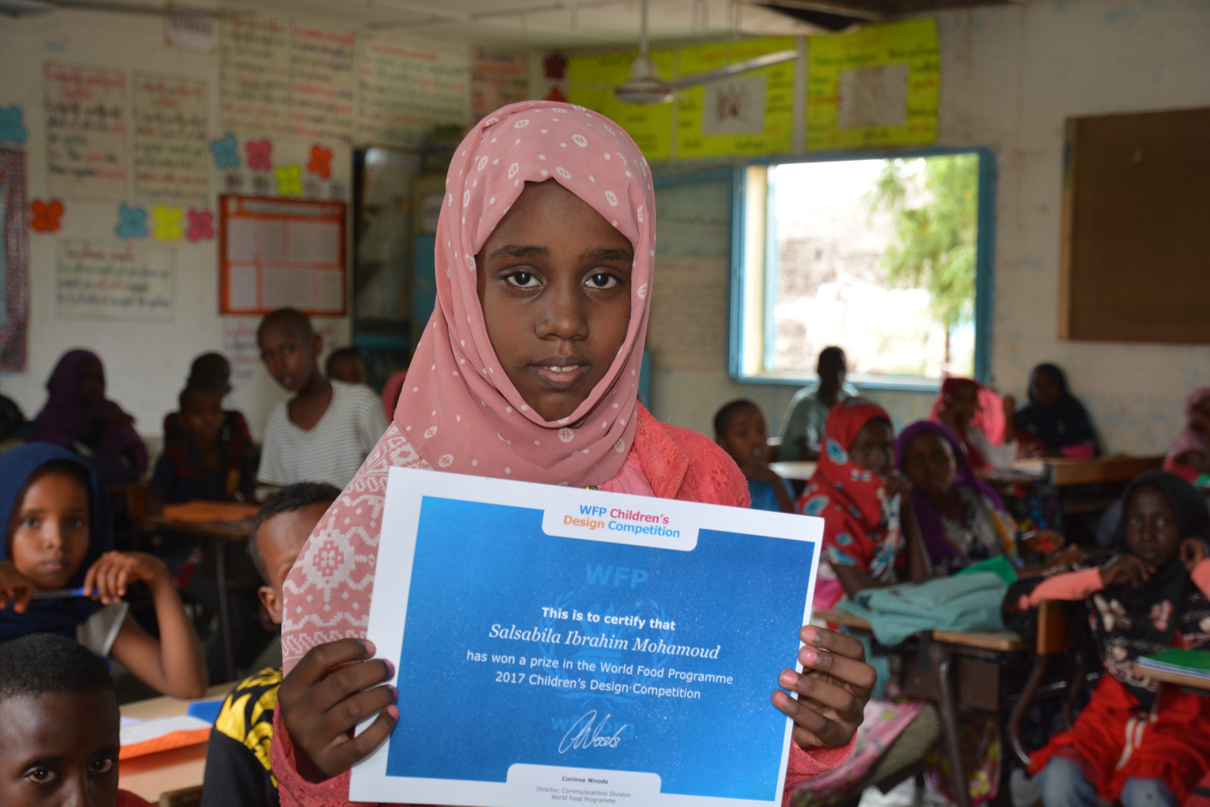 Djibouti, Dickhil, 25 September 2017

Salsabila Ibrahim Mohamoud, 11 years old, from Dickhil in Djibouti, was a winner of the 2017 global WFP Childrens Design Competition and is one of the students benefiting from these programmes. Salsabila and 17,000 children receive a morning snack and a hot lunch. WFP also provides take-home rations of vegetable oil to girls like Salsabila in grades three to five to, encourage parents to send their daughters to school

Like many girls her age, Salsabila loves to dress up as a princess while playing in the courtyard of her house with sisters and brothers. When asked where she sees herself in the future, her answer is immediate: I would like to become the Minister of Education so I can give to all children the school of my dreams and continue the school meals to give them energy to study in Djibouti.

In the Photo: Salsabila, from Dickhil in Djibouti, displays her certificate after winning in the WFP Childrens Design Competition. 

Photo: WFP/Miguel Tomas