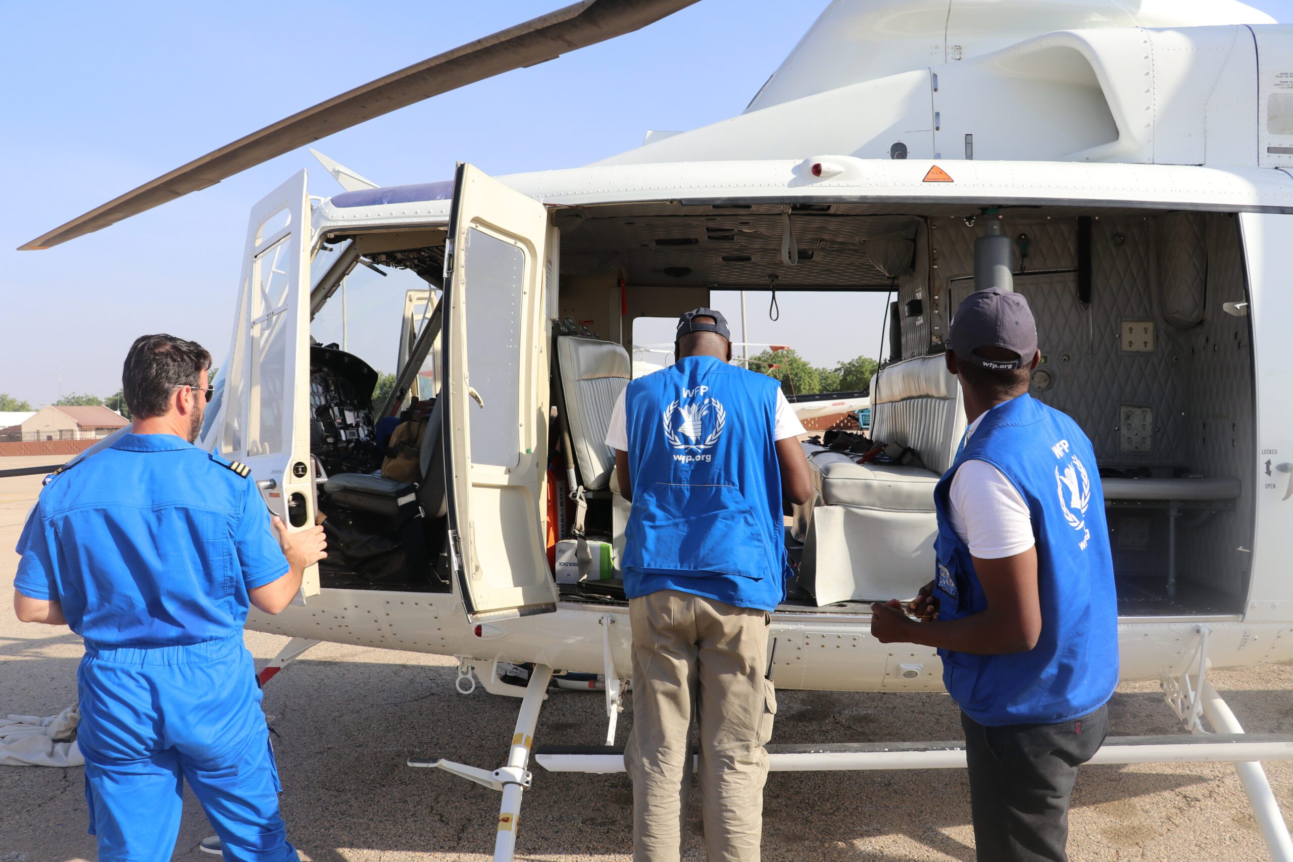 Nigeria, Monguno, 21 January 2017

Coupled with the existing challenges of extreme poverty, underdevelopment and climate change in the Lake Chad region, Boko Haram violence has led to one of the most acute and sorely neglected humanitarian crises in the world.

Some 7.1 million people need food assistance across four countried - Nigeria, Cameroon, Chad and Niger. Famine looms for over 120,000 people in the areas most affected by crisis in north-east Nigeria.

As malnutrition rises to alarming levels in all four countries, over half a million children are suffering from severe acute malnutrition.

In north-eastern Nigeria alone, some 1.9 million people have been forced to flee their homes due to conflict and insecurity. Almost 200,000 refugees from Nigeria are registered in neighbouring countries - finding shelter within host communities who were already among the poorest in the world.

In the photo: during a Rapid Response Mission (RRM) to Monguno, WFP distributed food to 78,000 people. Here, members of the WFP RRM team disembark the helicopter.

Photo: WFP/Amadou Baraze