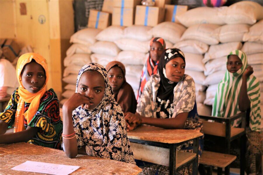 schoolgirls sitting in classroom