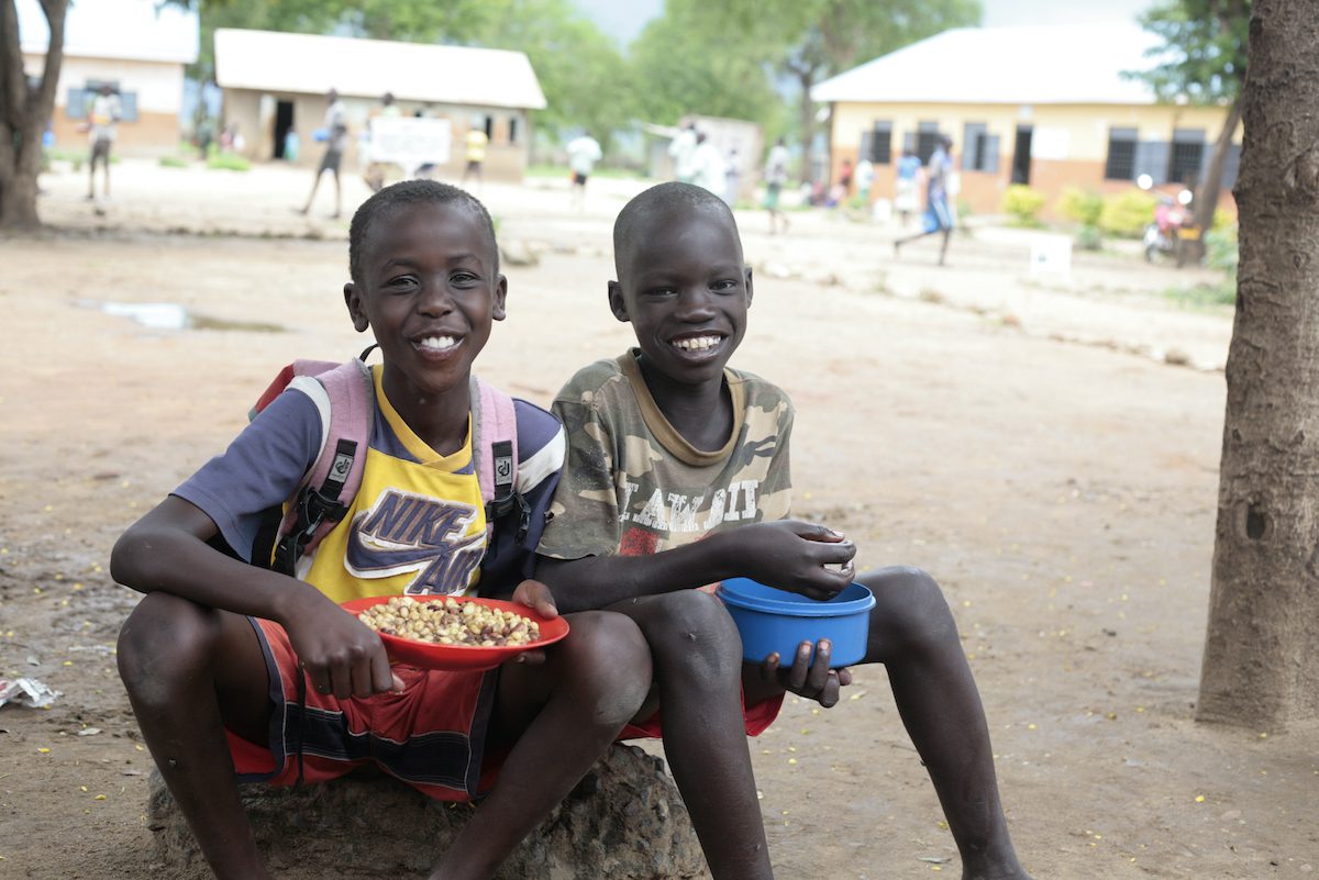 Uganda, Kalotom Primary School, Ngoleriet sub-county, Napak District, 10 April 2018 

School children in areas where food security, nutrition and education indicators are low receive one nutritious meal per day from WFP or the Government. WFP also works with the ministries of education, agriculture and finance to establish a national school feeding policy and a sustainable school meals programme which includes the purchase of ingredients from local smallholder farmers.

In the Photo: David Cosmas Lotukei (left) and Eric Ilukol (right).

DAVID COSMAS LOTUKEI
Age:  9 years. 
Class: He is in Primary Three at Kalotom Primary School in Ngoleriet sub-county, Napak district. 
Home:  He lives with both his parents, Andrew Longoli, his father works as an assistant account while his mother, Christine Nalem is a peasant. He has two sisters; Vanessa Ojawo and Vivinne Akol and a brother John Onyang.  The family lives in a village called Matany in Napak district. 
Favourites: He likes playing football with his friends at school.
His future:  He desires to become an engineer.
If he had a superpower: “I would make very fast and strong cars”.
Advice to children: “Help your families and villages by doing chores like sweeping the compound”.


ERIC ILUKOL
Age:  12 years. 
Class: He is in Primary Three at Kalotom Primary School in Ngoleriet sub-county, Napak district. 
Home:  Eric stays with both his parents in Lorengechora village in Napak district. His father, Simon Cybong Ilukol is a health worker at Iriiri Health Centre III in Napak while his mother, Joyce Akol is a peasant. He has three sisters; Grace Nakuwari, Georgina Nakong and Viola Nakuwari, and a brother, Owen Ilukol.
Favourites: He likes playing football and participating in athletic at his school.  His favourite food is rice and meat.  
His future:  He wants to become a Preacher in the Catholic Church.
If he had a superpower: “I would promote good hygiene and sanitation in homes”.
Advice to children: “Respect elders in the village”.

Photo: WFP/Davinah Nabirye