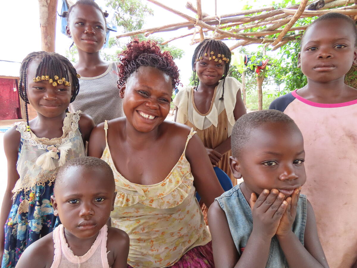 family smiling and sitting together