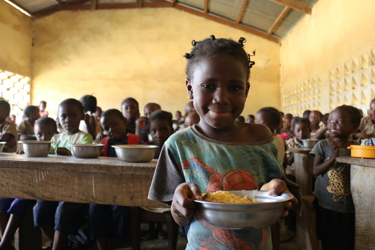 Donelvie, an indigenous girl, with her school meal

In the Republic of Congo, the indigenous people represent 2% to 5% of the population and are among the most marginalized and vulnerable groups. These populations have precarious living conditions: half of the children do not have a birth certificate and two-thirds of indigenous children do not attend school. Historically marginalized socially, economically and politically, these groups are all the more vulnerable because they have limited access to social protection.

In February 2020, a program financed by the Joint SDG Fund to improve indigenous peoples&#039; access to social protection was launched. This project is a joint effort of WFP, WHO, UNICEF and the Congolese government. Planned for a period of two years, it will be implemented in 5 districts of the Lékoumou department (Sibiti, Mayéyé, Komono, Zanaga, Bambama).

In this programme, WFP provides school meals in indigenous schools, nutrition items in health centers, and supports indigenous smallholders’ farmers groups.