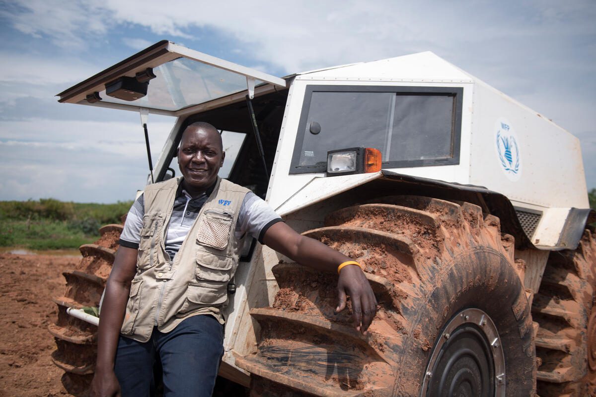 Uganda, Lake Victoria, 28 June 2018

WFP’s Global Fleet team has introduced a pioneering new vehicle to its Supply Chain – to make sure life-saving food gets to communities in the hardest-to-reach places and most challenging of circumstances.

Nenad Grkovic, WFP Global Fleet Manager said: “We are working in places that are very hard-to-reach because of floods and heavy rains – so WFP decided to innovate and use these new trucks to ensure we can help these families to survive during these hard times.”

SHERP All-Terrain Vehicles are designed to cope with the toughest road conditions and can easily overcome any obstacle in its way, float and move out of the water – so it can offer a more direct and cost-effective solution than helicopter airdrops. WFP plans to deploy the SHERP vehicles to make last mile deliveries of its nutritious food commodities through inaccessible roads to reach vulnerable and stranded communities.

The vehicles can hold 1.2 tonnes of food and has very low fuel consumption and can travel for around 500-600Kms on a full tank. WFP estimates the SHERP will cut transport costs significantly too – at 200 USD per metric ton instead of using helicopters at 4,000 USD per metric ton.

“The potential of these vehicles for WFP and other humanitarian actors is amazing,” continues Nenad, “by giving us access to beneficiaries in natural disasters such as earthquakes and tsunamis – this could be a new life-saving innovation in WFP’s Supply Chain.”

The trucks will initially be used in the East and Central African region – with three being deployed to South Sudan and three to Democratic Republic of Congo. In June, WFP’s Global Fleet, Regional Bureau Nairobi and the Uganda Country Office simulated a testing ground for the new All-Terrain Vehicle to see its potential to make challenging last mile deliveries. SHERP trained WFP drivers from South Sudan and global fleet managers on operating the vehicles – through the shores of Uganda.