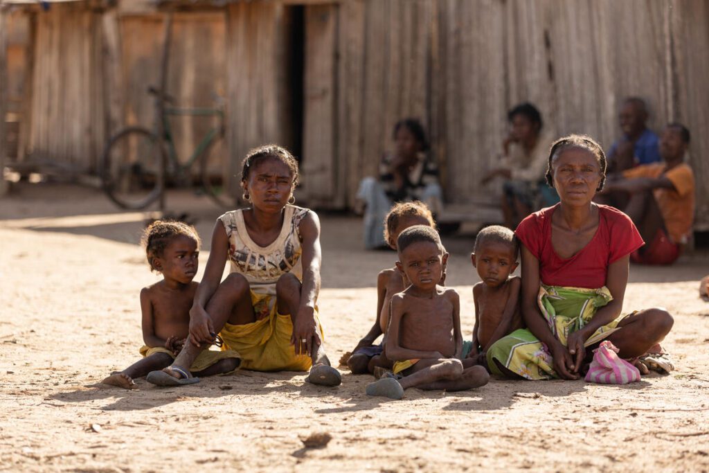 family sitting on the ground