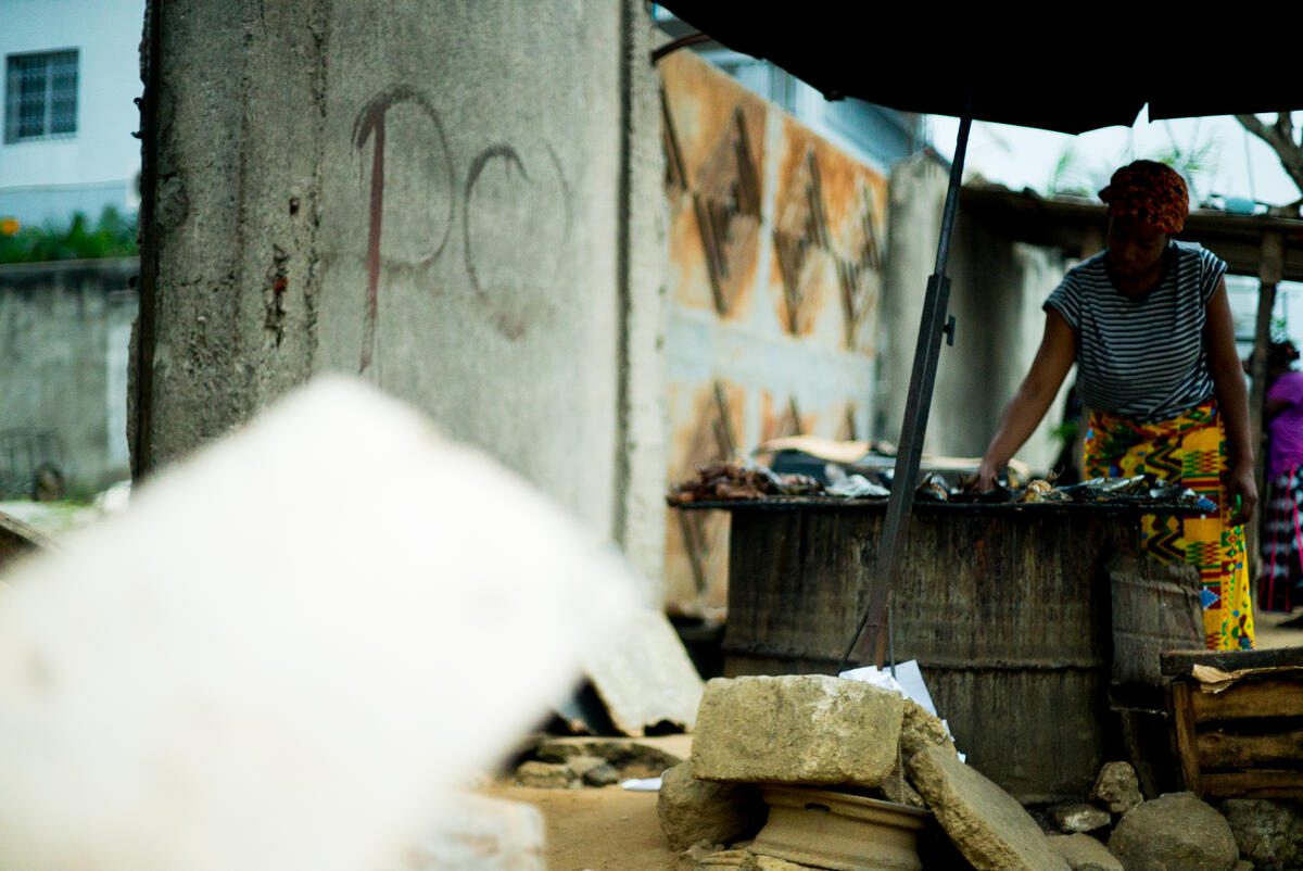 Salome, a beneficiary of the cash-transfer program and one of the 430,000 HIV positive people in Côte d&#039;Ivoire, looks after the cooking of her smoked fish.  It is a popular food choice in the country, and Salome relies on selling it to make end&#039;s meet. With the arrival of the Covid-19 pandemic, her business shrank and she struggled to buy the nutririous food she needs to take the Anti-Retroviral drugs she needs for the HIV treatment.

To support people living with HIV during COVID-19, WFP in Abidjan, Cote D’Ivoire piloted a cash-transfer project together with The United Nations Joint Program on HIV &amp; AIDS (UNAIDS). WFP work with governments, partners, and communities to provide food, nutrition assistance and social protection services for people living with or affected by HIV and TB, including in emergency settings. Since 2020, WFP has provided support to over 1,000 people in Abidjan, Cote D’Ivoire who have faced the socio-economic impact of COVID-19. 

 

Malnutrition and food insecurity continues to affect vulnerable people, especially those living with HIV. WFP’s cash-transfers project has been piloted in several countries including Cote D&#039;Ivoire and Chad to improve nutritional outcomes among food insecure and malnourished people living with HIV. WFP continues to deliver food or cash transfers in that regard.  

 

Food insecurity is one of the key drivers associated with increased transmission of HIV and can be a barrier to treatment adherence while malnutrition is linked to higher mortality rates among new ART clients. Antiretroviral therapy (ART) is key to people living with HIV and reaching the goal of eradicating AIDS as a public health threat by 2030, non-medical aspects of the epidemic also need to be addressed. 

 

WFP hired externals to film and permit the agency to demonstrate how it is working to respond to the needs of people living with HIV through specific interventions in Grand Abidjan, Cote D&#039;Ivoire.  

  

WFP identified beneficiaries/c