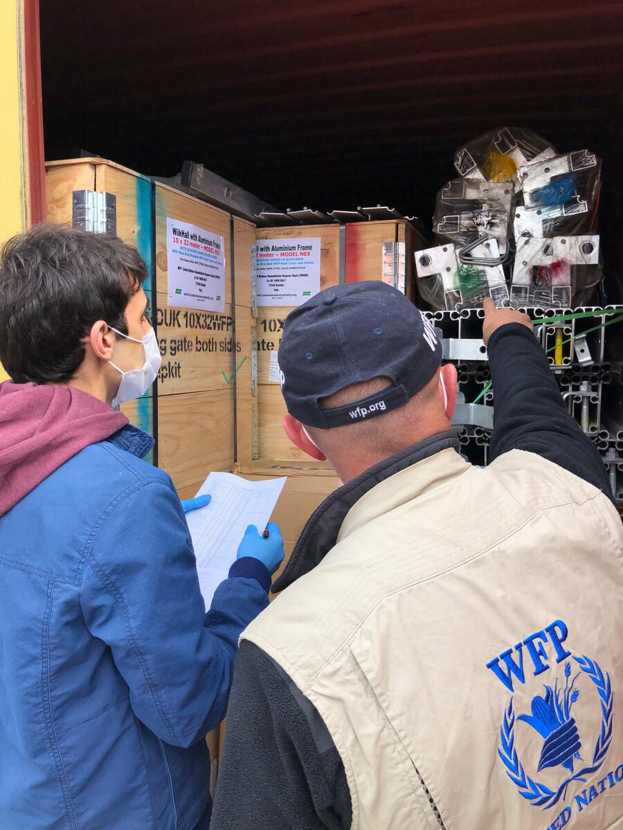 2019–20 coronavirus pandemic
WFP Armenia is fortunate and proud to receive MSUs (Mobile Storage Units) to Armenia, which supposed to be used to provide humanitarian goods to the people. Thanks to WFP corporate funding, WFP Armenia has procured and transferred MSUs to Armenia to be prepared and answer to any type of emergency. MSUs will play a critical role during COVID19 response. One of the MSUs will be given to our partner ICRC.

In the Photo (from left to right): Tigran Mshetsyan (WFP Logistics Business Support Assistant) and Yessai Nikoyan (Head of Supply Chain), assisting the offloading of  the Mobile Storage Units in Yerevan.

Photo: WFP/Alessandro Moretti