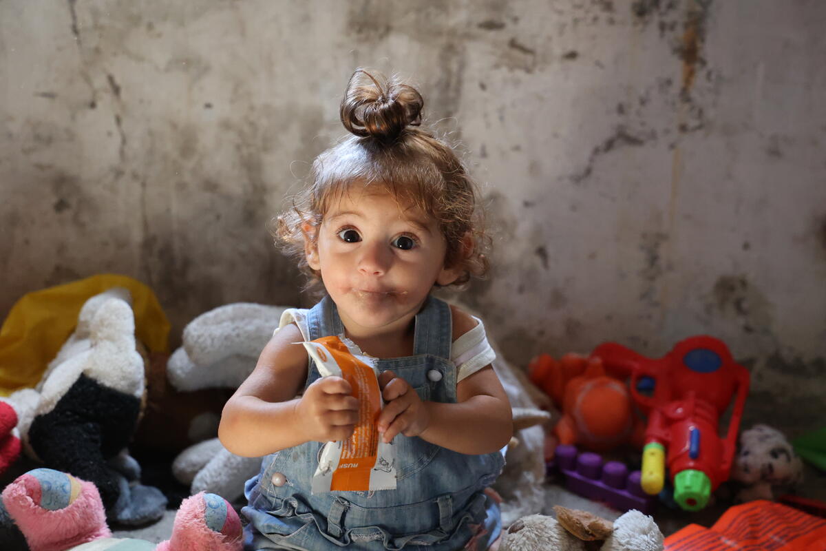 young girl eating nutritional bar
