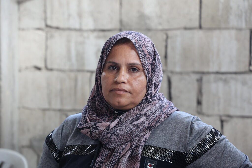 woman in purple headscarf