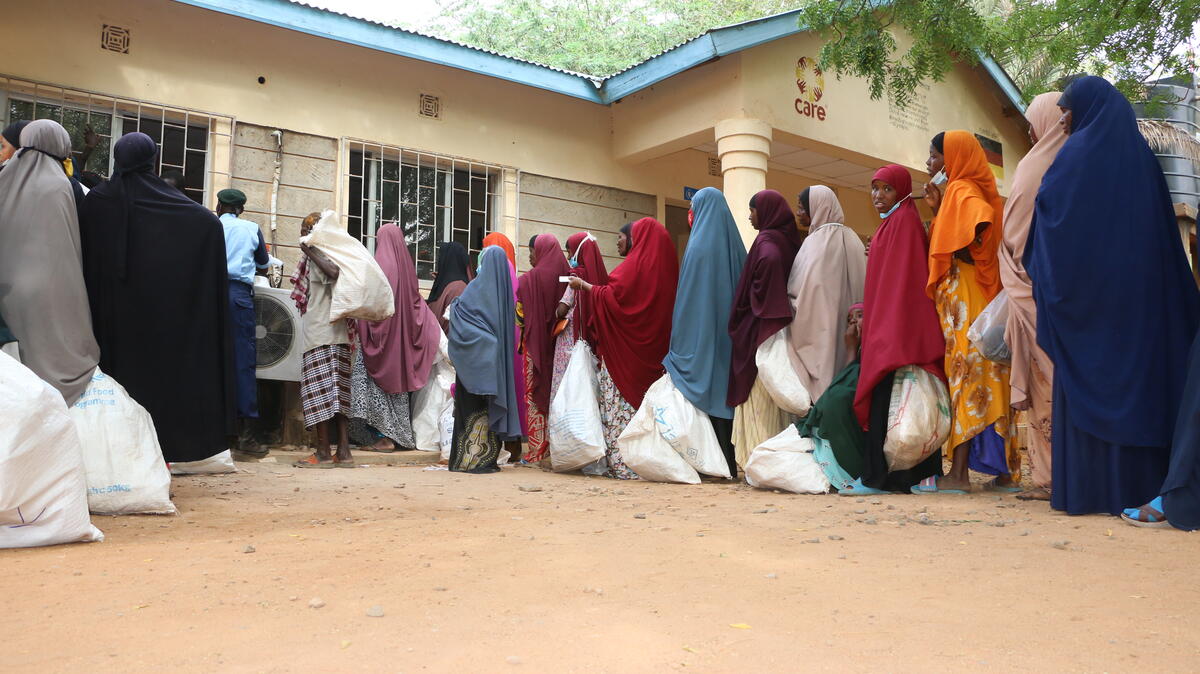 women at WFP distribution site queuing to collect their entitlement

Dadaab refugee camp is located in Garissa County, roughly 100km from the Kenya-Somalia border. WFP currently provides food to refugees and asylum seekers. Registered individuals receive a combination of in-kind and cash transfers, while those profiled receive in-kind food assistance. 

Due to the severe drought caused by five consecutive failed rain in the region is driving a significant influx of new arrivals to the Dadaab camp. Working with partners, WFP routinely provides specialized nutritious foods for the prevention and treatment of malnutrition in the camp which is on the high rise due to negative coping strategies such as skipping meals to address household food insecurity.