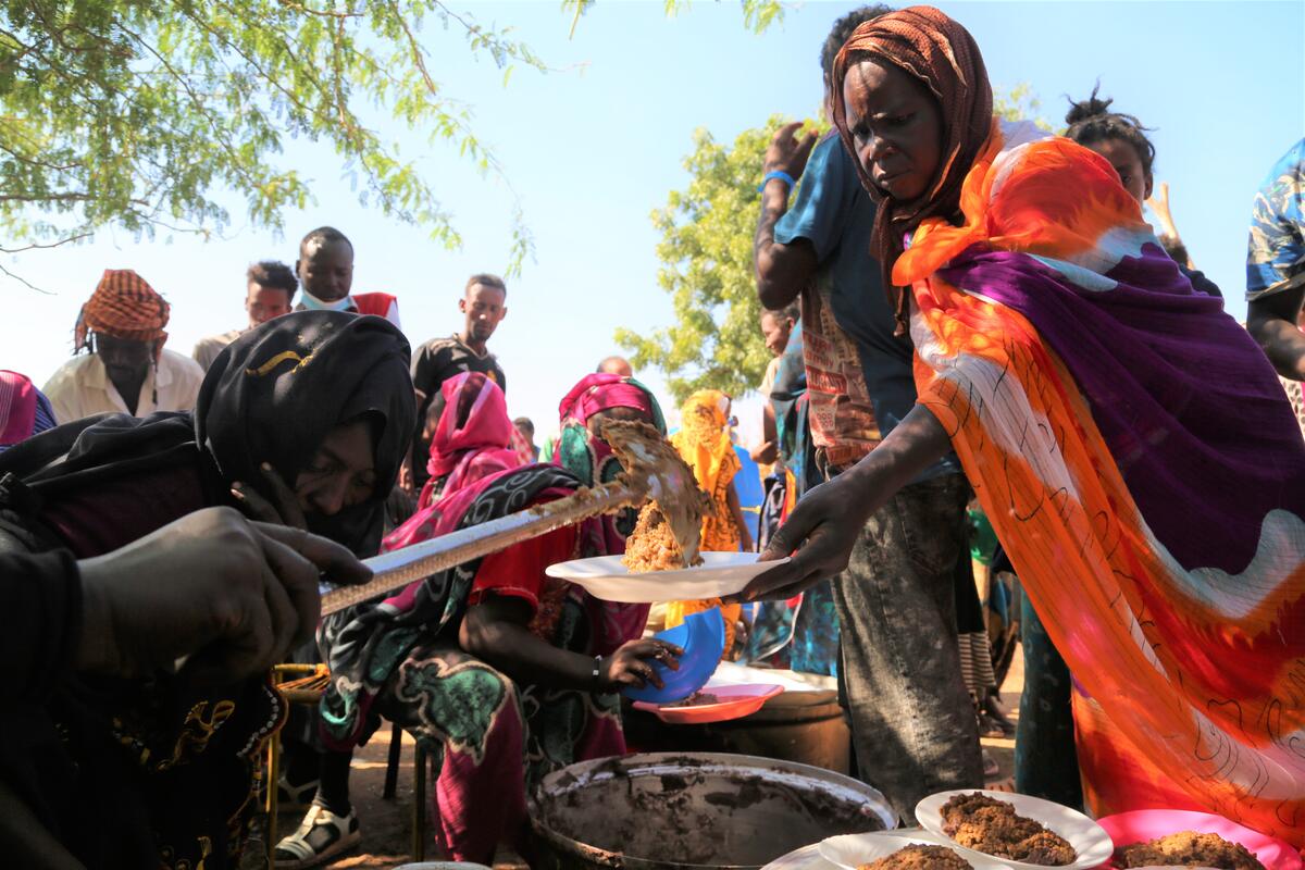 Sudan, Um Rakuba Refugee Camp, Gedaref State, 18 November 2020

In the photo: Ethiopians fleeing intense fighting in their homeland of Tigray, gather in the neighbouring Sudanese Um Rakuba Refugee Camp, Gedaref State.

Photo: WFP/Leni Kinzli

WFP is providing food for Ethiopian refugees who are being resettled in Um Rakuba Refugee Camp in Gedaref State, Sudan after crossing the border from Ethiopia. People who newly arrive are receiving hot meals and high energy biscuits and will receive one month of dry rations including lentils, sorghum, oil and salt once they receive cooking utensils to prepare their own food.