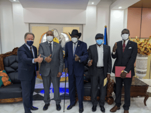 WFP Chief David Beasley stands with Sudanese government and rebel leaders