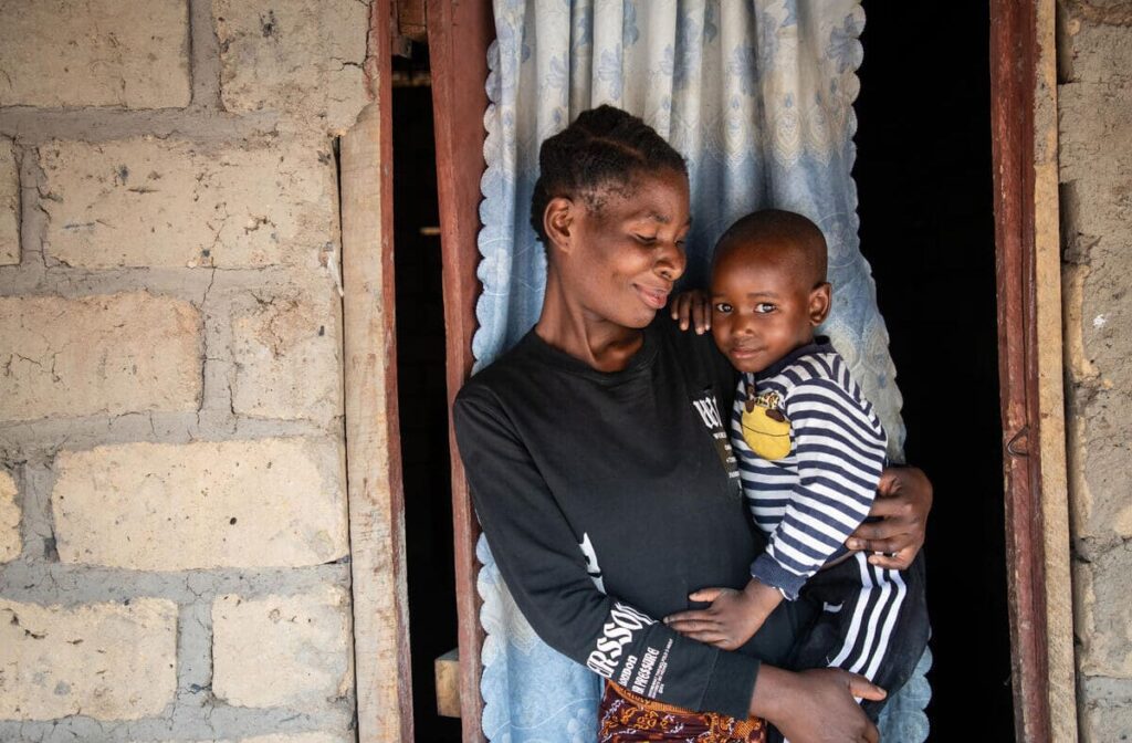 Mother holding her son in Zambia