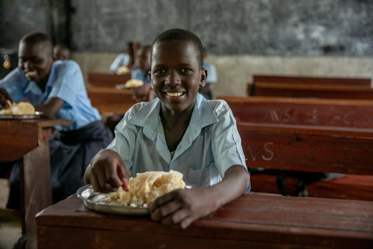Andrew Lodikio eating lunch in South Sudan