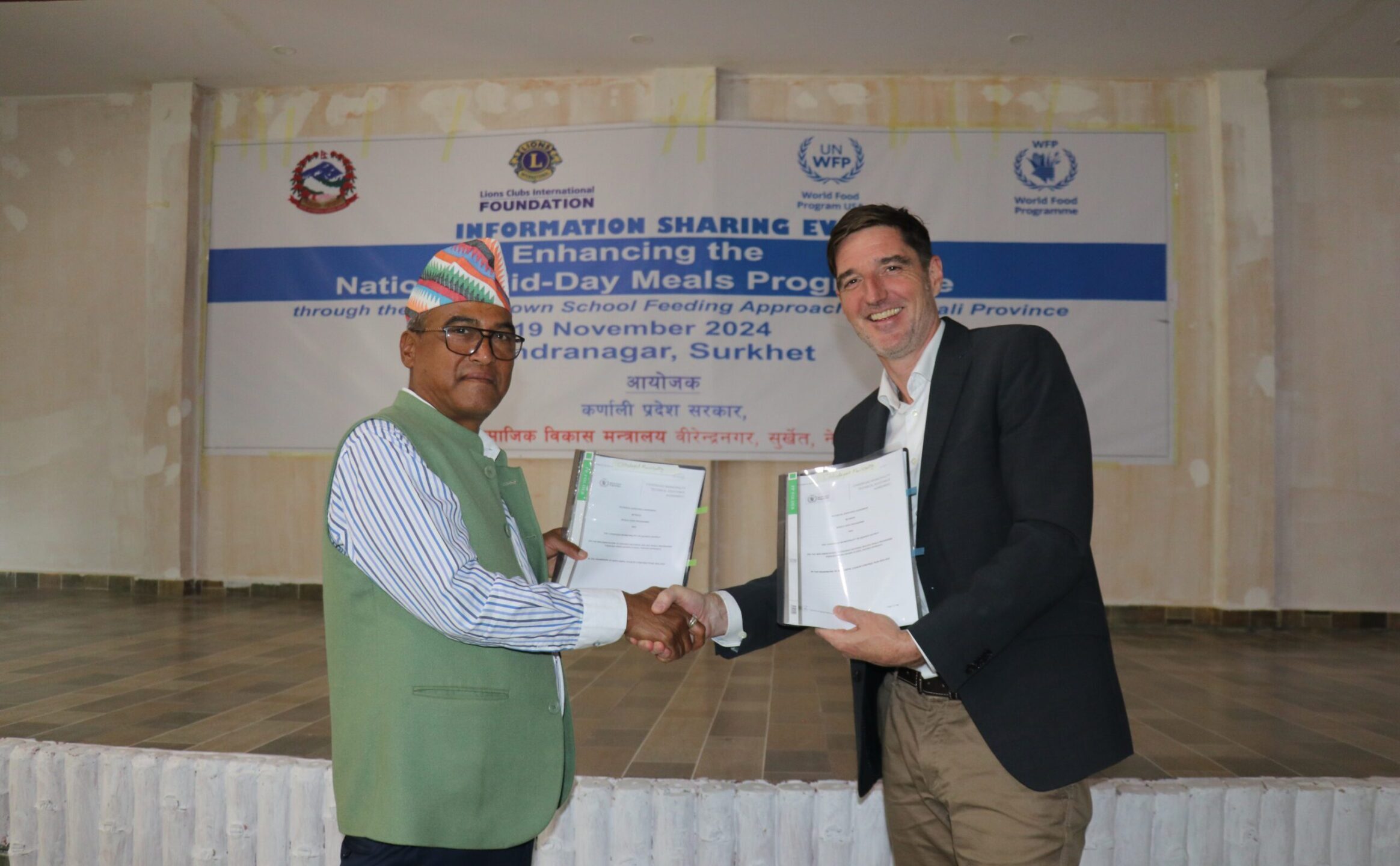 WFP staff signing an agreement in Nepal
