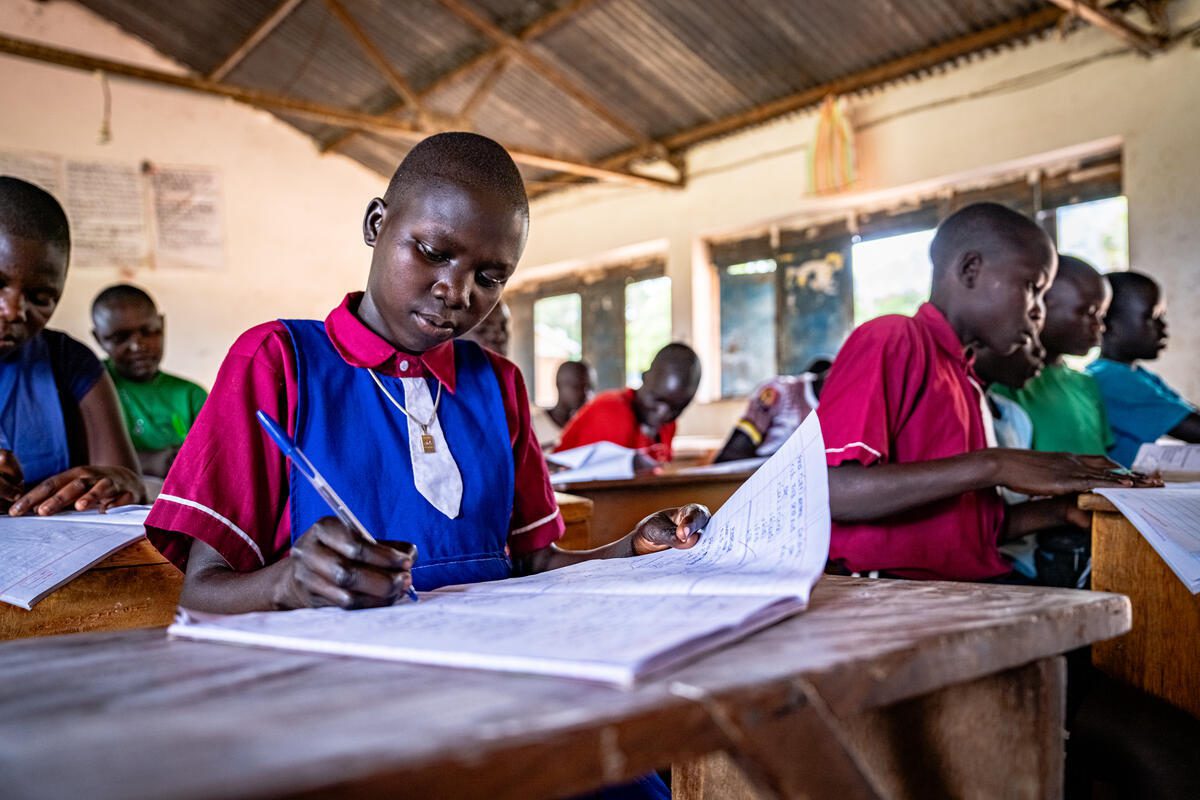 Student in classroom in Uganda