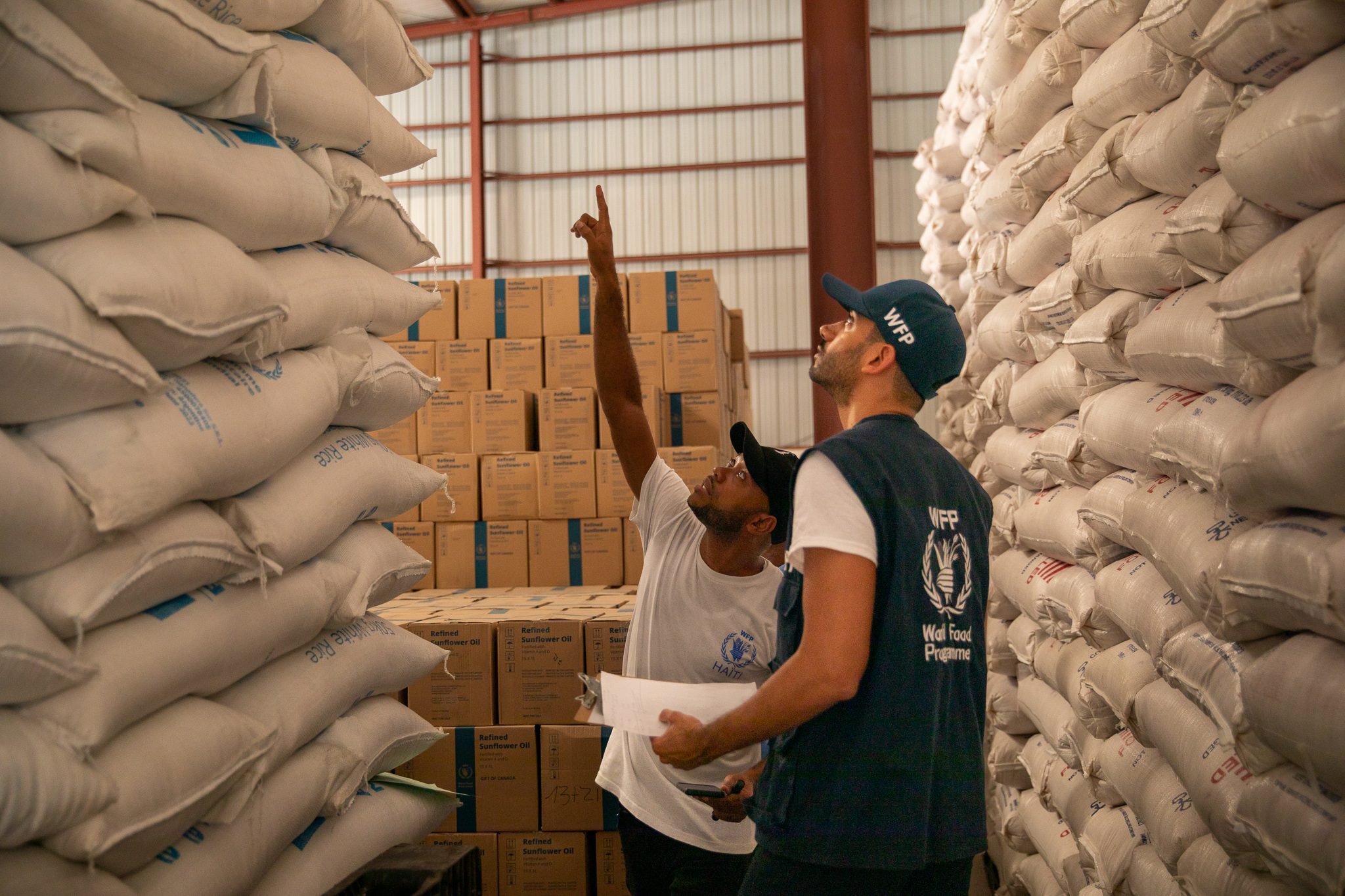 Photos of WFP&#039;s warehouse in Port-au-Prince during the monthly inventory

Port-au-Prince warehouse where we store over 2,000 metric tons of food for sudden emergencies as well as for the school feeding programme. Right now, every week eight trucks are dispatched from this warehouse to support families that are affected by gang violence and WFP is preparing for the beginning of the school year.
