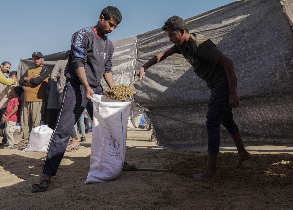 Community making sand bags